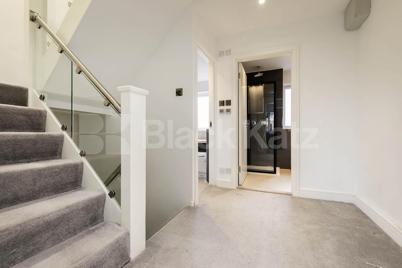 This beautifully presented three-bedroom split-level house is located on the sought-after Lennon Road in the heart of Willesden Green Marley Walk, London, NW2,  London