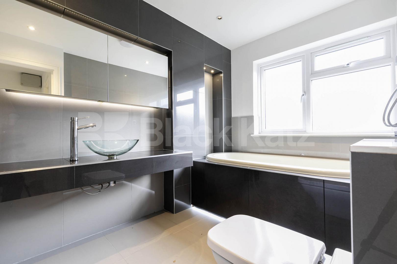 This beautifully presented three-bedroom split-level house is located on the sought-after Lennon Road in the heart of Willesden Green Marley Walk, London, NW2,  London