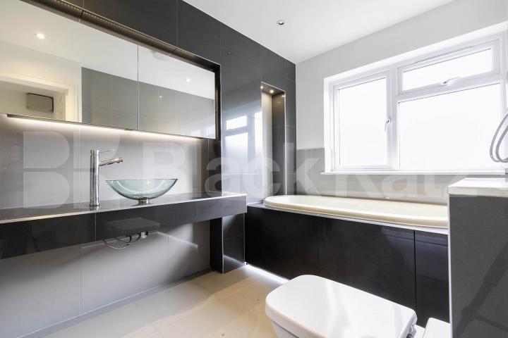 This beautifully presented three-bedroom split-level house is located on the sought-after Lennon Road in the heart of Willesden Green Marley Walk, London, NW2,  London