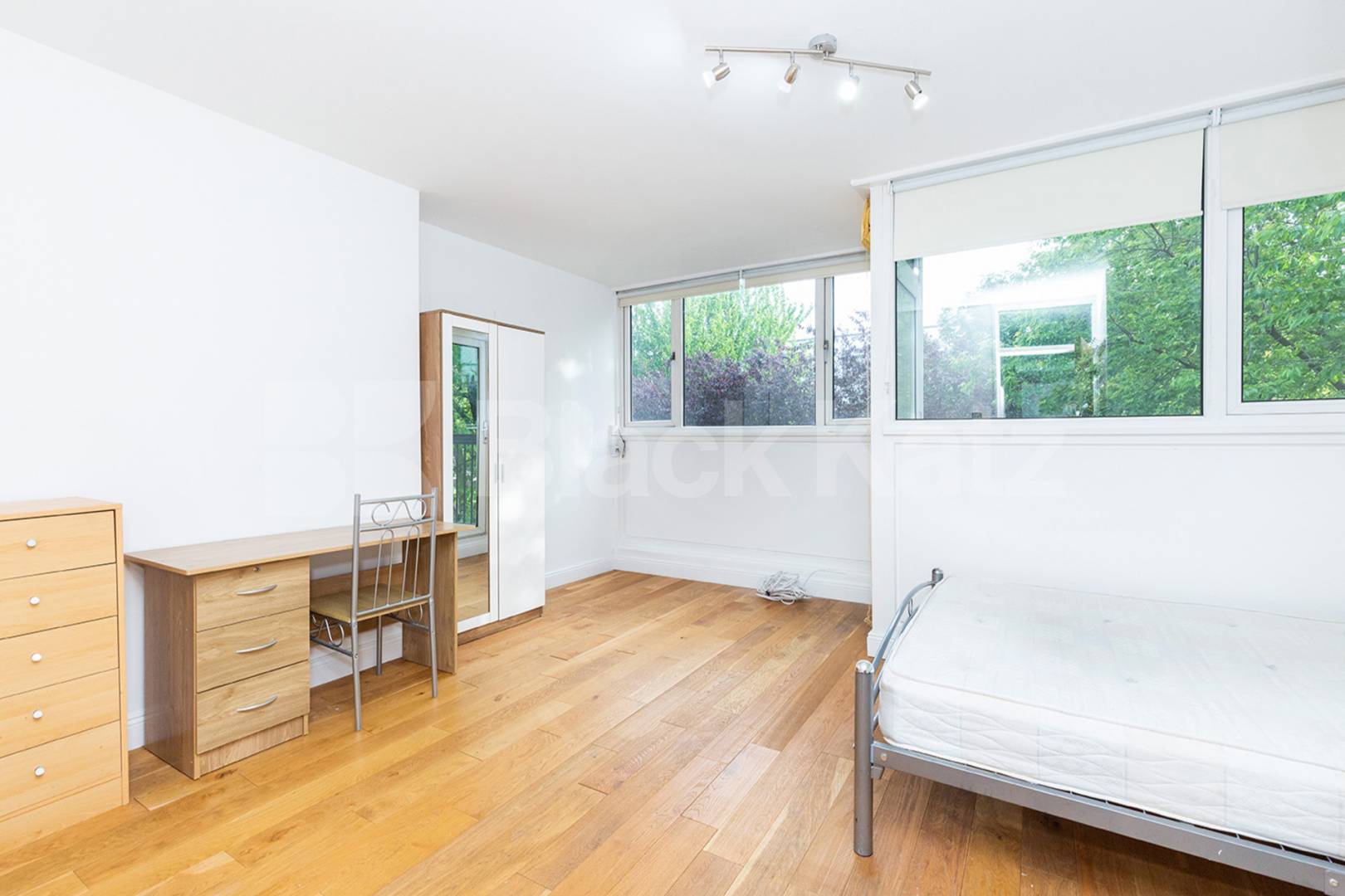 Modern three double bedroom flat arranged over two floors with Balcony Rowstock Gardens, Camden Borders 