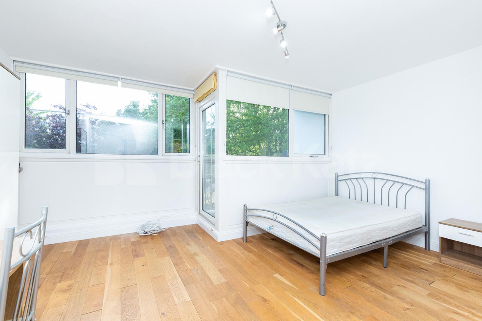 Modern three double bedroom flat arranged over two floors with Balcony Rowstock Gardens, Camden Borders 
