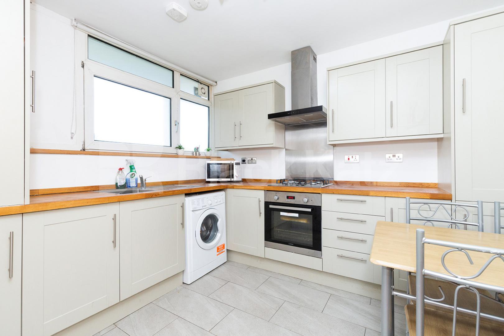 Modern three double bedroom flat arranged over two floors with Balcony Rowstock Gardens, Camden Borders 