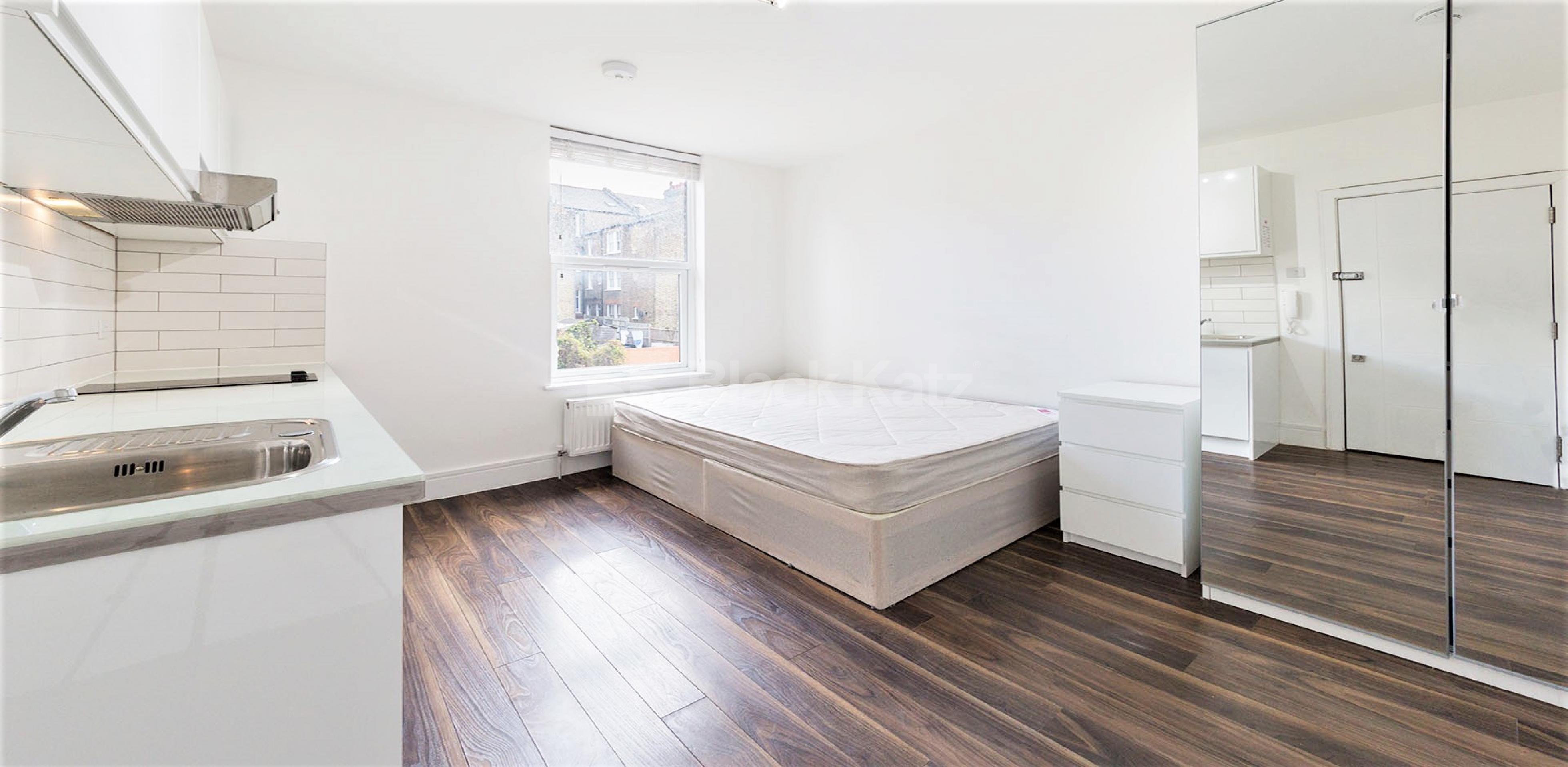 A bright, fully furnished studio in NW10, featuring an open-plan living space, fitted kitchenette, and private bathroom Rucklidge Avenue, London, NW10,  London NW10