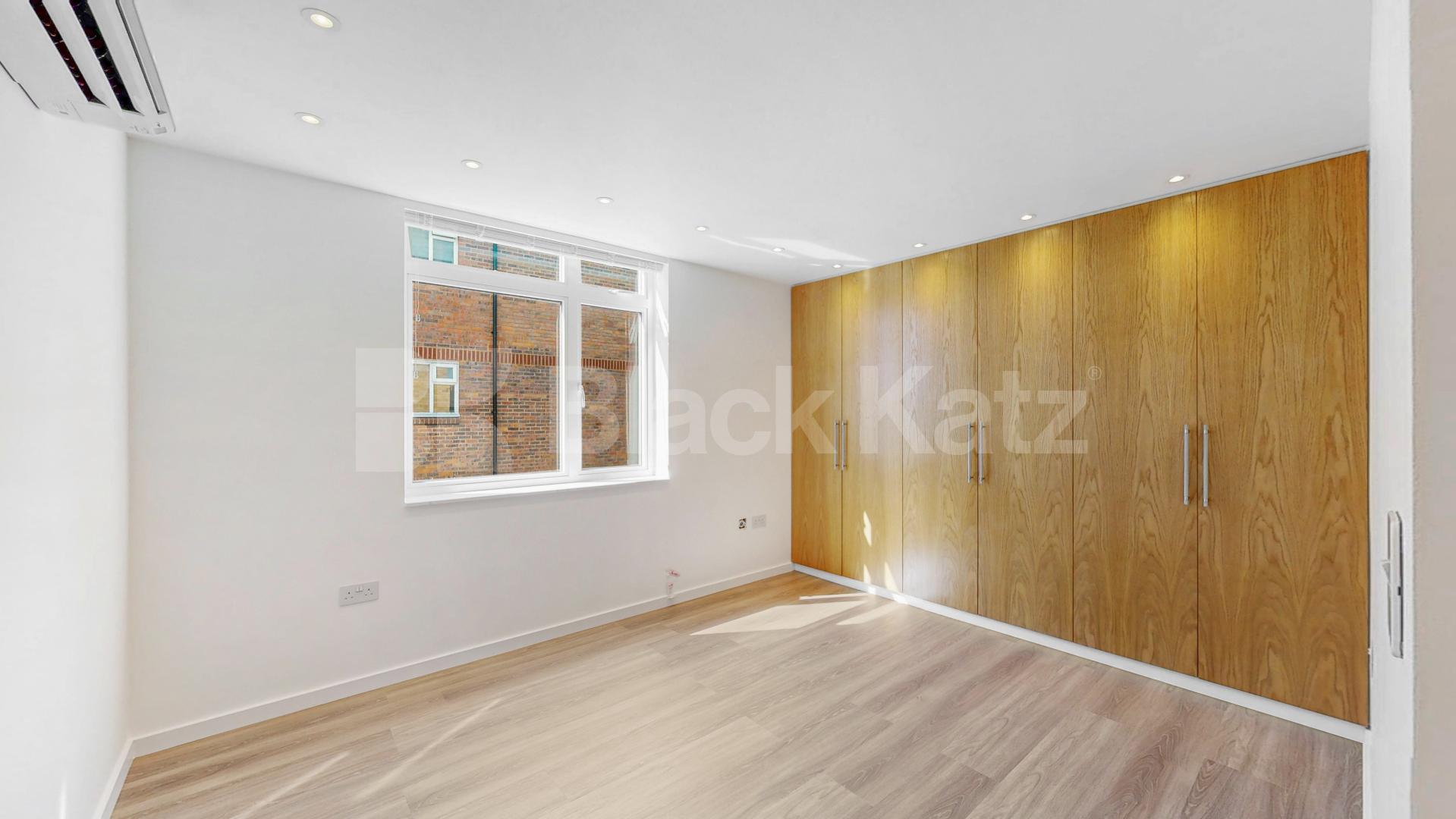A stunning fully renovated three-bedroom apartment finished to an exceptional high standard throughout The Oaks, London, NW6,  The Oaks