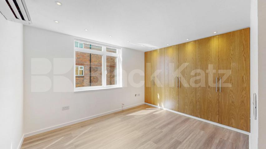 A stunning fully renovated three-bedroom apartment finished to an exceptional high standard throughout The Oaks, London, NW6,  The Oaks