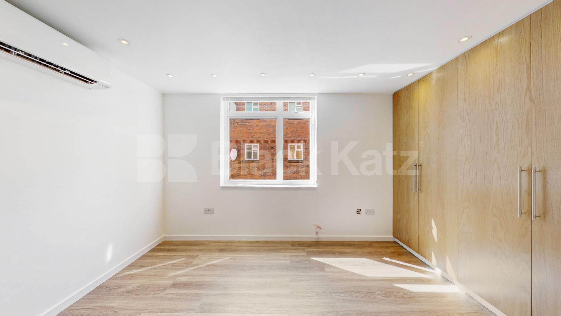 A stunning fully renovated three-bedroom apartment finished to an exceptional high standard throughout The Oaks, London, NW6,  The Oaks