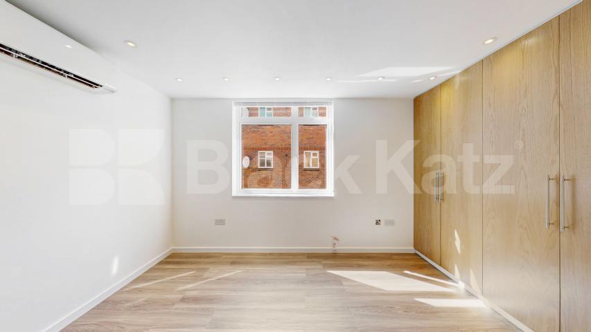 A stunning fully renovated three-bedroom apartment finished to an exceptional high standard throughout The Oaks, London, NW6,  The Oaks