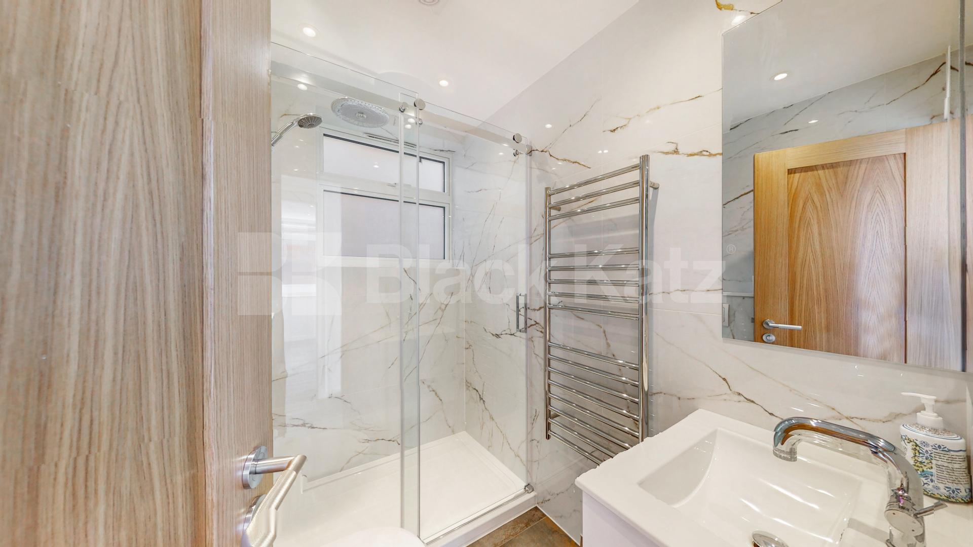 A stunning fully renovated three-bedroom apartment finished to an exceptional high standard throughout The Oaks, London, NW6,  The Oaks