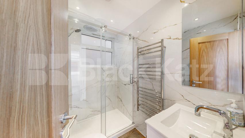 A stunning fully renovated three-bedroom apartment finished to an exceptional high standard throughout The Oaks, London, NW6,  The Oaks