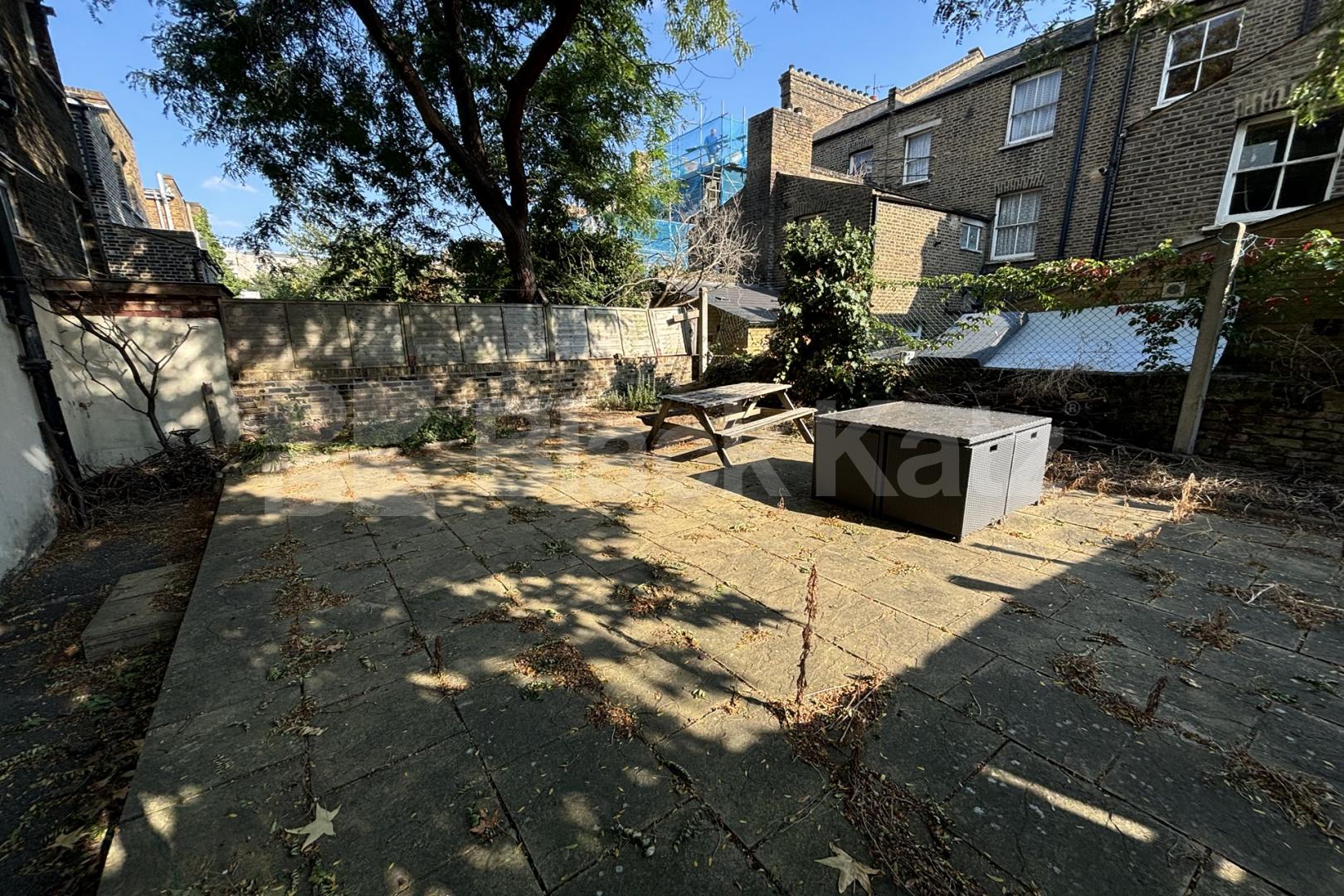 Georgian conversion spread on the ground floor with charming patio garden  Wansey Street, London Bridge