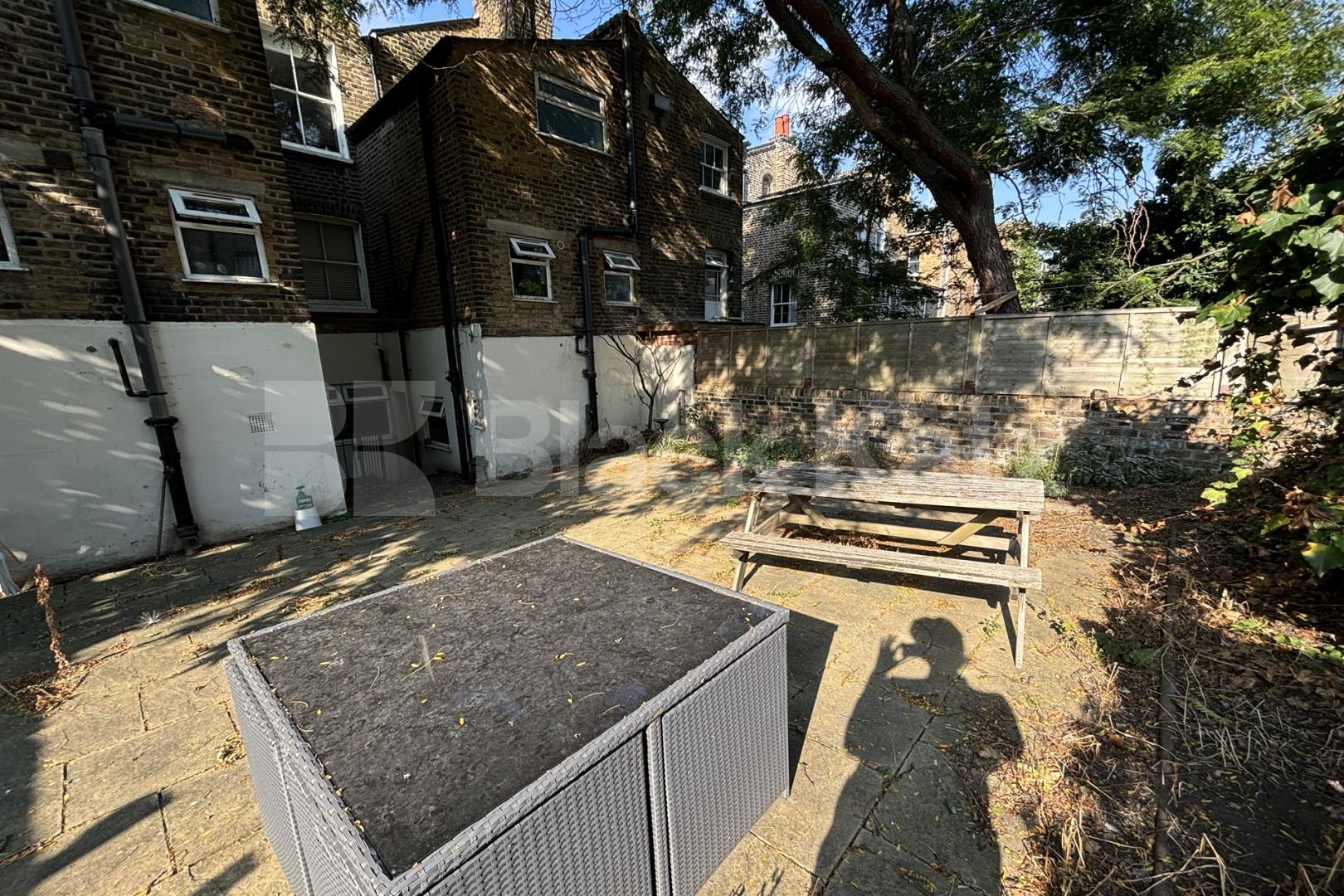Georgian conversion spread on the ground floor with charming patio garden  Wansey Street, London Bridge