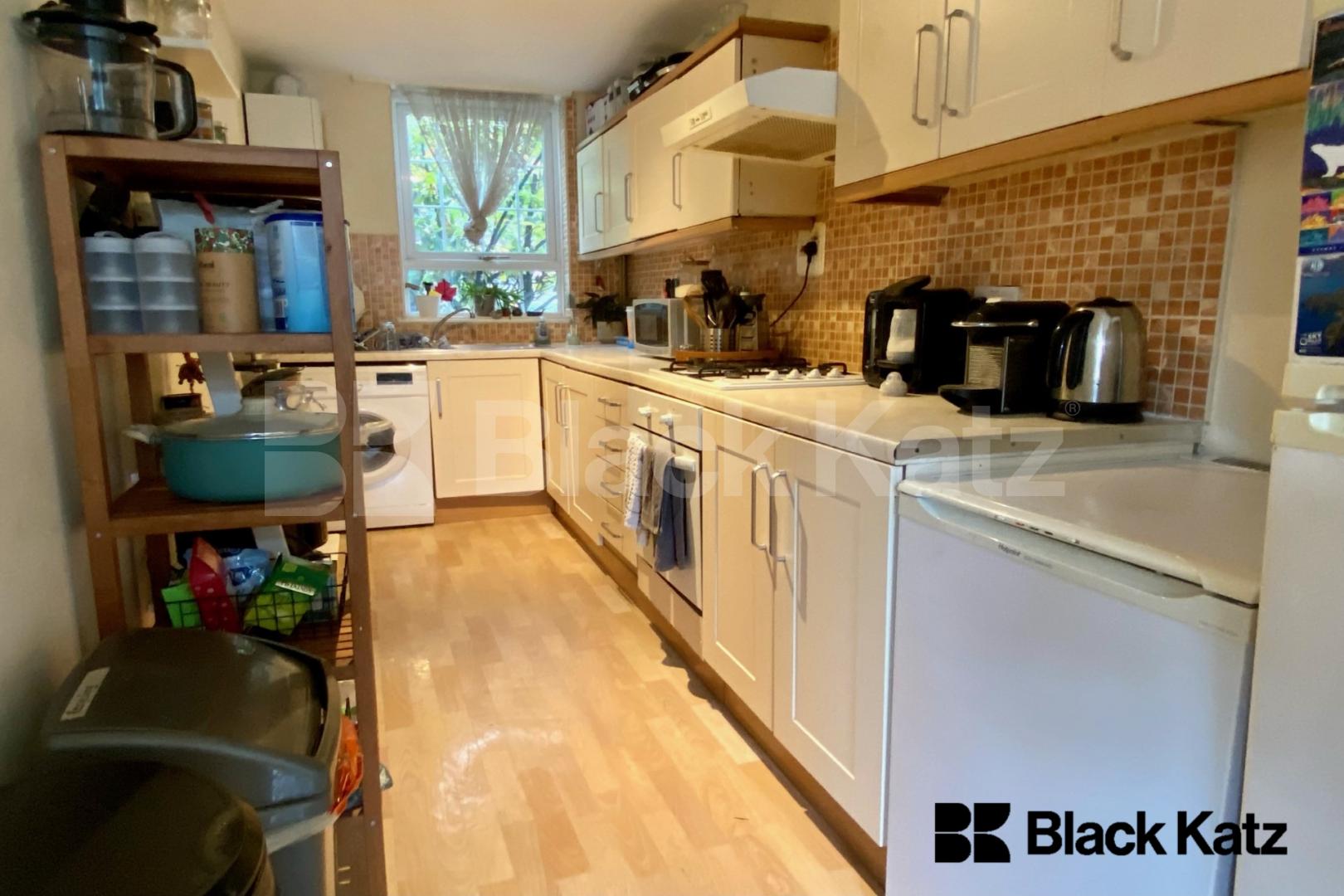 Spacious split level house with parking & charming patio garden Garratt Lane, Earlsfield