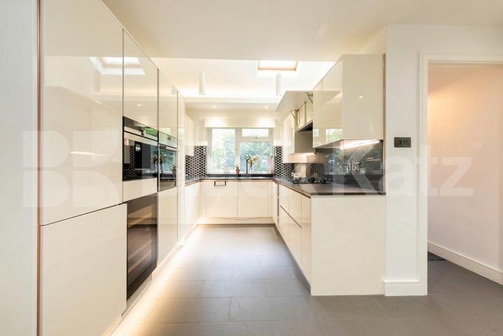 This beautifully presented three-bedroom split-level house is located on the sought-after Lennon Road in the heart of Willesden Green Marley Walk, London, NW2,  London