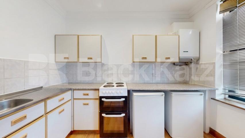 A well-presented three-bedroom split-level apartment located on Finchley Road, NW3 Finchley Road, Hampstead, NW3,  London